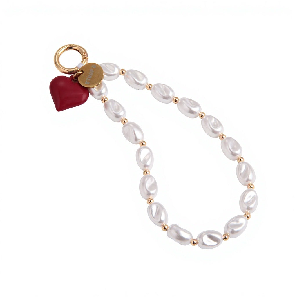 pearl strap with red hold and gold clasp